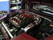 1997 Ford Probe - Close-up of a car's engine bay, showing custom intake piping and a red-painted manifold.