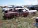 1968 Ford Coupe - Junkyard scene with multiple abandoned vehicles, including a damaged 1967-1968 Ford Mustang fastback.