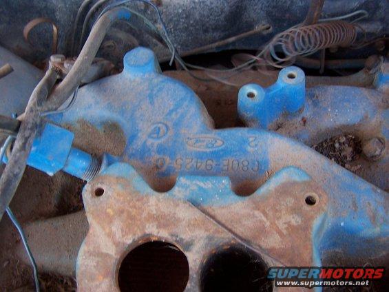 Blue Ford intake manifold with part number C8OE-9425-C visible