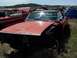 1968 Ford Coupe - Junkyard scene with a 1968 Ford Coupe in the foreground, other vehicles visible.