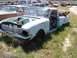 1968 Ford Coupe - This light blue pickup truck is in a state of disrepair, with many parts missing and rust evident.