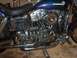 1976 Harley-Davidson Super Glide - The detail of the engine and exhaust system on this Harley-Davidson motorcycle is visible.