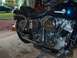 1976 Harley-Davidson Super Glide - A 1976 Harley-Davidson Super Glide motorcycle is shown from the side in a garage setting.