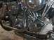 1976 Harley-Davidson Super Glide - This photo shows a detailed view of a motorcycle's engine and exhaust system, with prominent chrome accents.