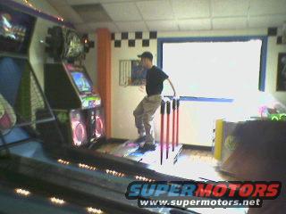 "Dance Dance Revolution", with an older guy gittin' it!