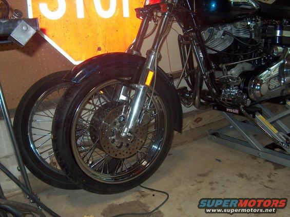 1976 Harley-Davidson Super Glide front wheel, engine, and part of the frame. A second wheel is visible behind the front one