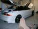 1996 Ford Probe - A white coupe with its hood and trunk open, revealing the engine bay and rear storage area.