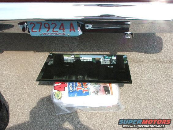 Rear bumper with Wisconsin license plate 27924 A and a piece of glass on towels