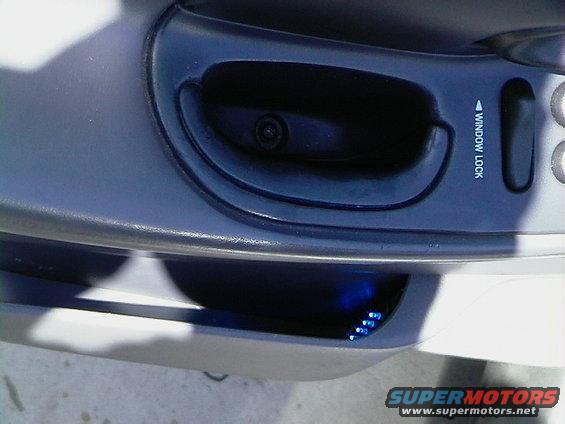 Interior door panel with window lock and blue LEDs