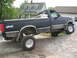 1979 Ford F-150 - This pickup truck has a "4x4" decal on the rear fender and "F-150" badging on the front fender.