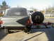 1987 Ford Bronco - Rear view of a 1987 Ford Bronco showing a custom bumper and spare tire carrier assembly.
