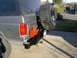 1987 Ford Bronco - Rear view of a gray 1987 Ford Bronco a custom bumper and spare tire carrier.