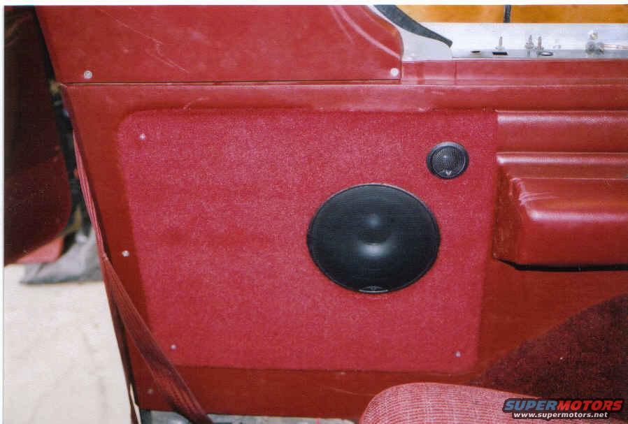 cut out plywood to fit hole, carpeted, and installed new rockford fosgate components