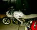 1986 Honda Interceptor - A white 1986 Honda Interceptor VFR700 motorcycle is shown from the side, with "HONDA" visible on the fuel tank.