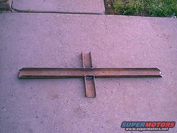 sub.jpg the Fox platfom had issues and the seats just olted to the floor. They like to tear our after time. I made this subframe connector out of 3" c-channel. the "ears" are what the seat bolt to. I still need to drill and paint it.