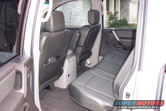 2004 Nissan Titan interior showing rear leather seats and door panel