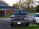1994 Ford Bronco - Front view of a 1994 Ford Bronco equipped with auxiliary lights on the roof rack.