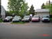 1999 Ford Crown Victoria - Multiple Ford Crown Victorias are parked in a residential driveway.