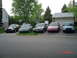1999 Ford Crown Victoria - Multiple Ford Crown Victoria sedans are parked in a residential driveway, displaying various colors and model years.