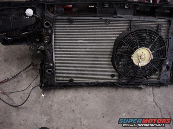 Radiator and fan assembly with wiring. Supermotors.net logo visible