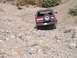1989 Ford Bronco - This Ford Bronco navigates a challenging, rocky off-road path.