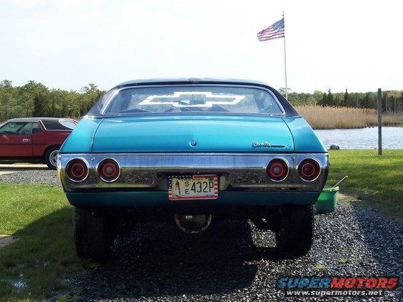 Teal 1971 Chevrolet Chevelle rear view with American flag