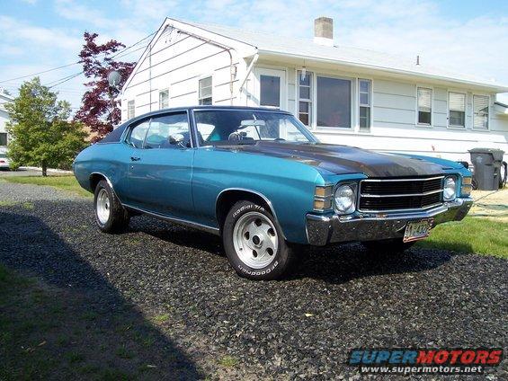Blue 1971 Chevrolet Chevelle coupe parked on gravel, front 3/4 view