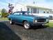 1971 Chevrolet Chevelle - A blue 1971 Chevrolet Chevelle coupe is parked in front of a white house.