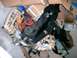 1996 Ford Probe - Various car parts and insulation are piled up with cardboard boxes.