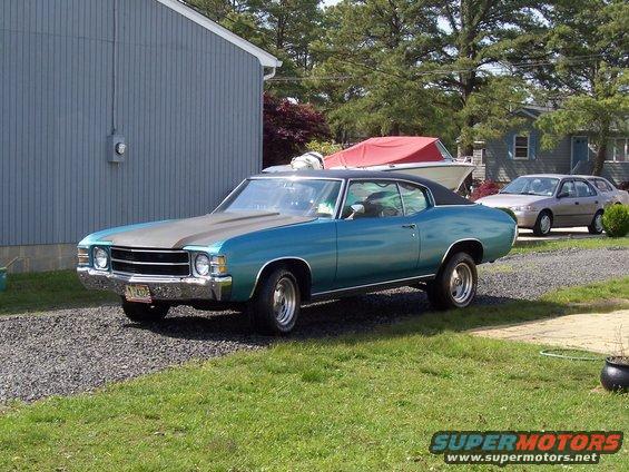 Blue 1971 Chevrolet Chevelle coupe with matte black hood stripe and black vinyl roof