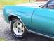 1971 Chevrolet Chevelle - Close-up of a vintage car's side panel and wheel, BFGoodrich tires and chrome accents.