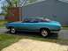 1971 Chevrolet Chevelle - This 1971 Chevrolet Chevelle coupe features a teal exterior with a contrasting black vinyl roof and classic rally wheels.