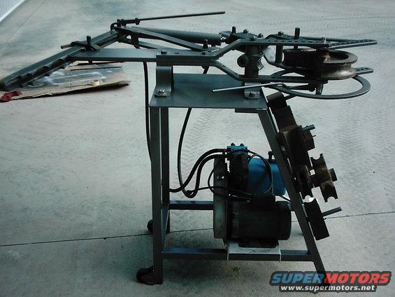 Metal bending machine with motor and various rollers
