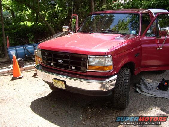 1995 Ford Bronco front quarter view, driver's side door open, parked outdoors