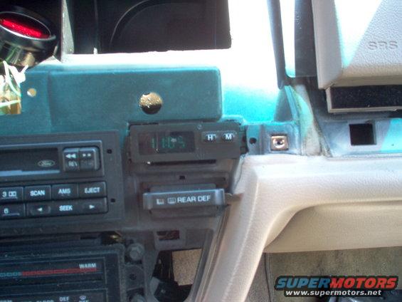 clock3.jpg It fit well, even without fasteners, so I decided to put it here permanently.  The wires reach without modification, and there's just enough room on the radio finisher to cut holes for the buttons.