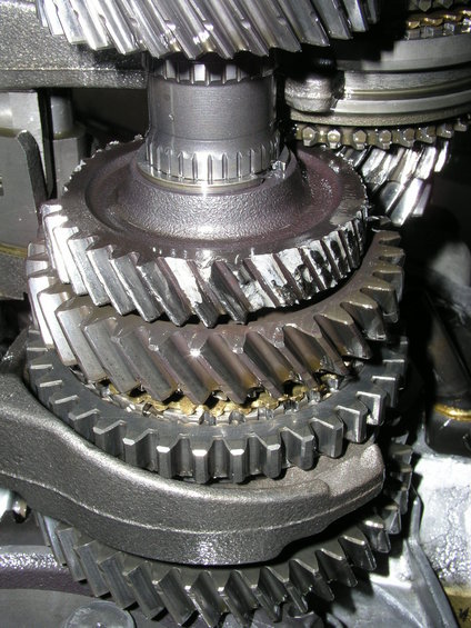 Close-up of damaged transmission gears with chipped teeth