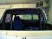 1994 Ford C-350 (Centurion Conversions) - The interior of a truck is visible, showing exposed wiring and a blue seat cover.
