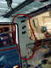 1994 Ford C-350 (Centurion Conversions) - Vehicle interior showing the A-pillar and roof framing during what appears to be a renovation or repair process.