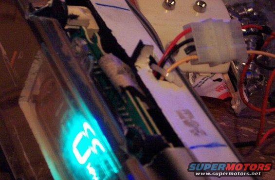 close-up of a blue digital display and wiring harness