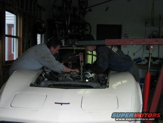 White 1981 Chevrolet Corvette front view, engine being worked on