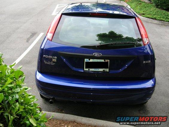 Rear view of a blue 2005 Ford Focus ZX5 hatchback parked in a lot