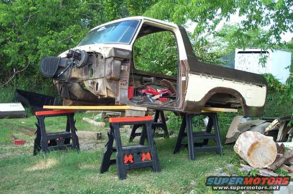 Disassembled 1979 Ford Bronco body on sawhorses, side view