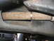 1989 Ford Bronco - Undercarriage detail with exhaust pipe and another vehicle visible.