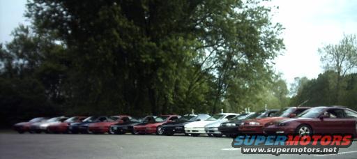 Line of cars parked side-by-side