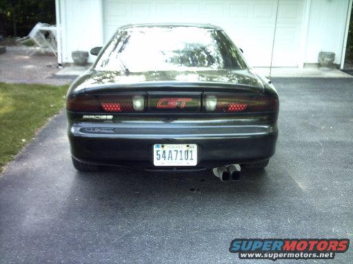 Black car rear with GT badge and dual exhaust pipes