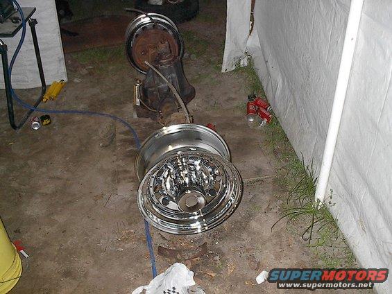Rear axle assembly with chrome wheels on concrete floor