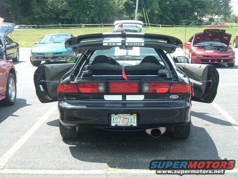 1997 Ford Probe rear view, doors and trunk open. Other cars visible in background