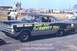 1967 Ford Fairlane - 1967 Ford Fairlane drag car with custom lettering on the side, parked at a drag strip.