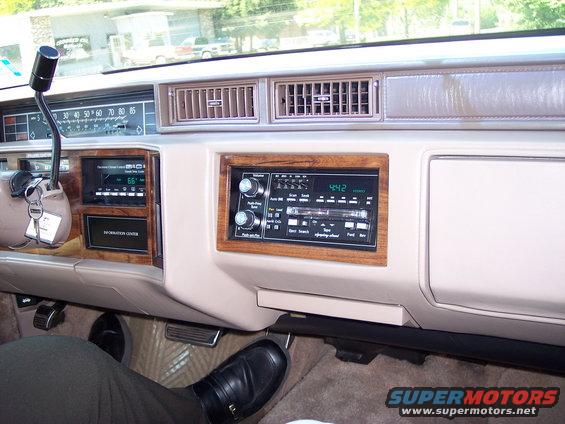 1991 Cadillac DeVille interior with wood trim dashboard and radio