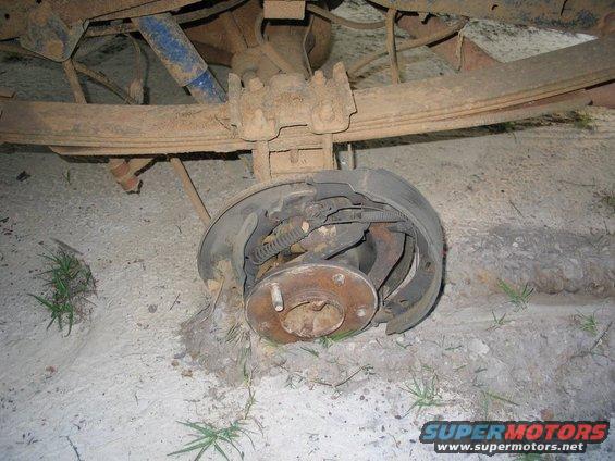 Rear axle with missing tire and brake drum. 1989 Ford F-150